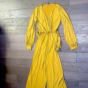 Sexy jumpsuit with flared bottom. Gold but more on the burnt yellow side.